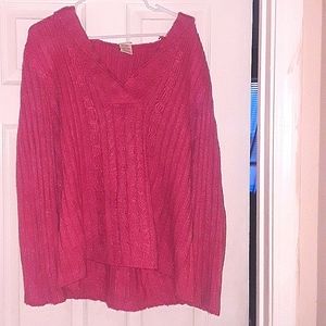 A knitted sweater with a hood